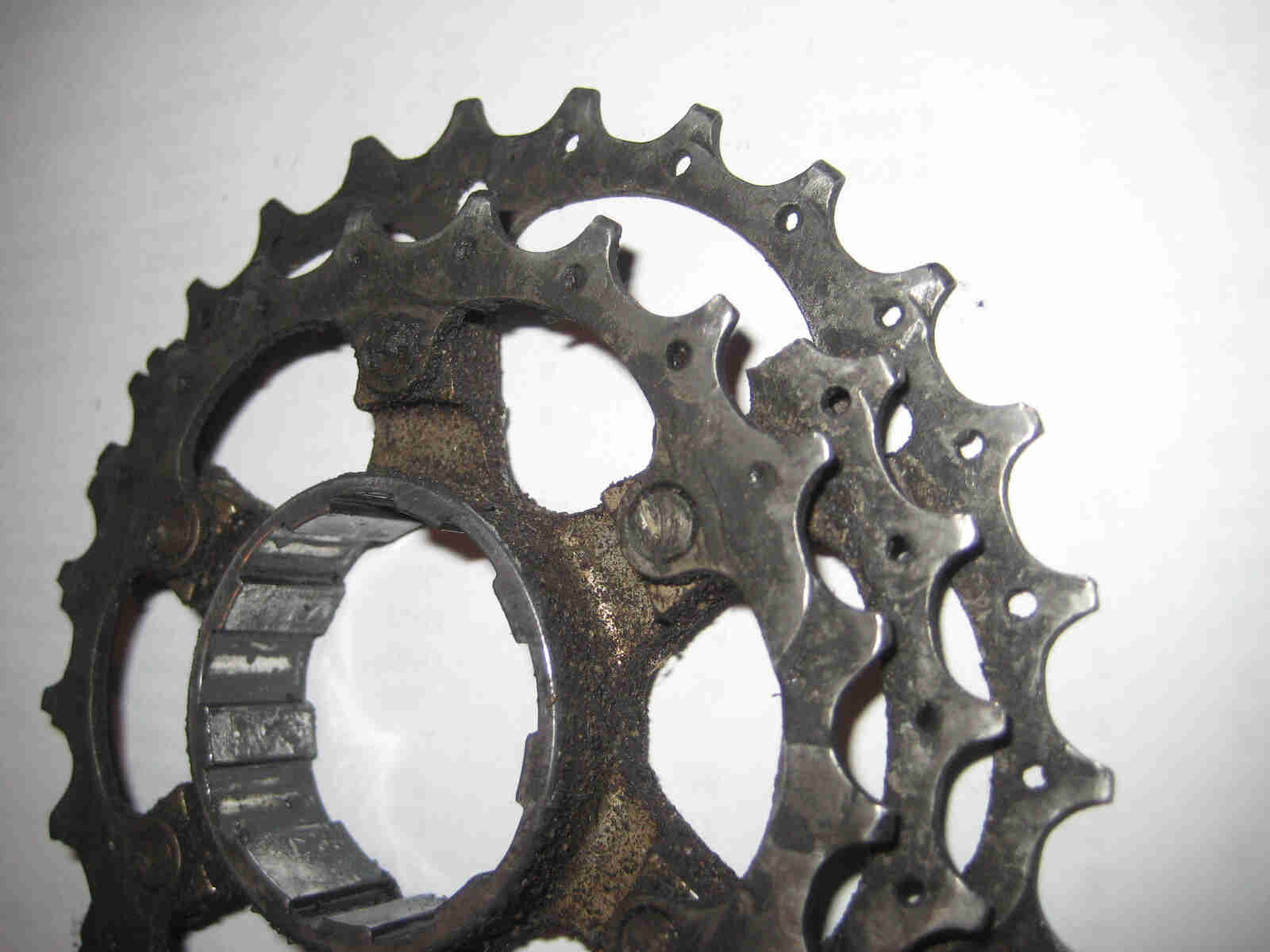 Flat, right side view of a bike chainring assembly, against a white background